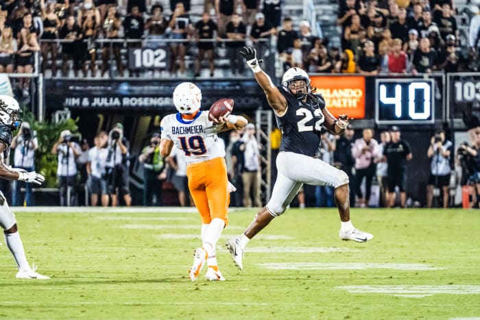 Kalia Davis Rushing Hank Bachmeier of Boise State